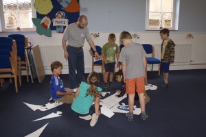 Richard helps Team Milky Way assemble their spaceship puzzle